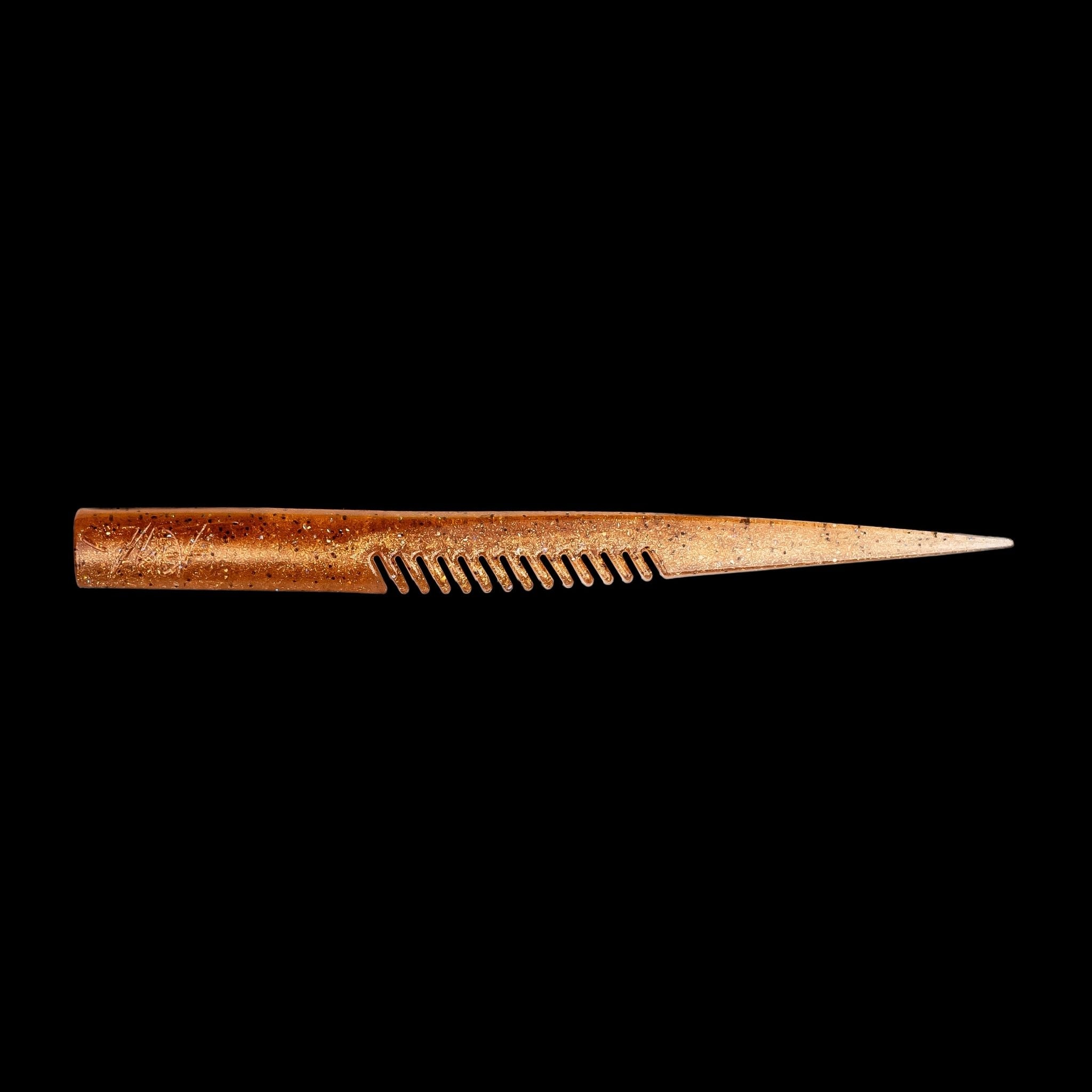 brown comb-like texture fishing lure on a black background