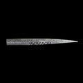 silver comb-like texture fishing lure on a black background