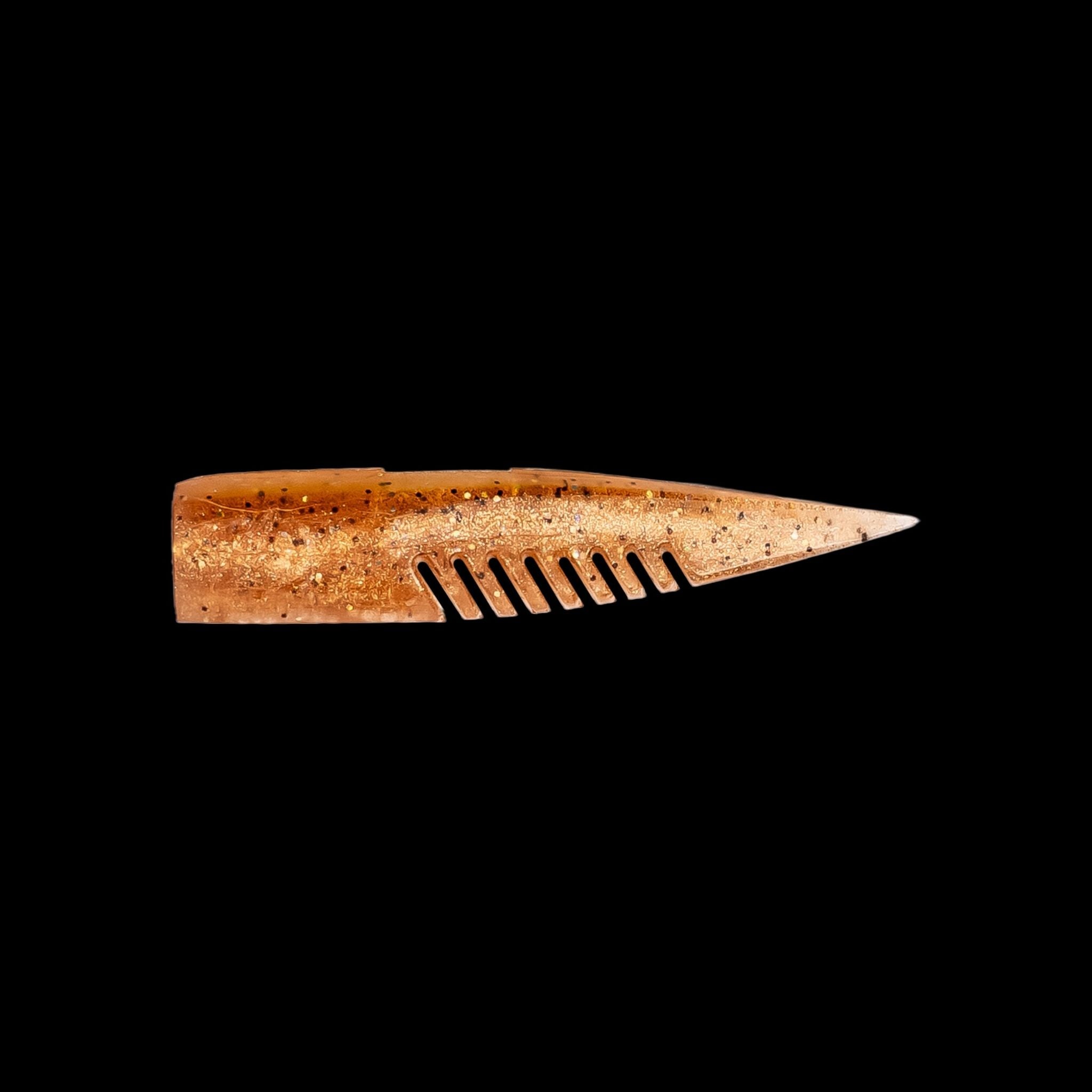 brown comb-like texture fishing lure on a black background