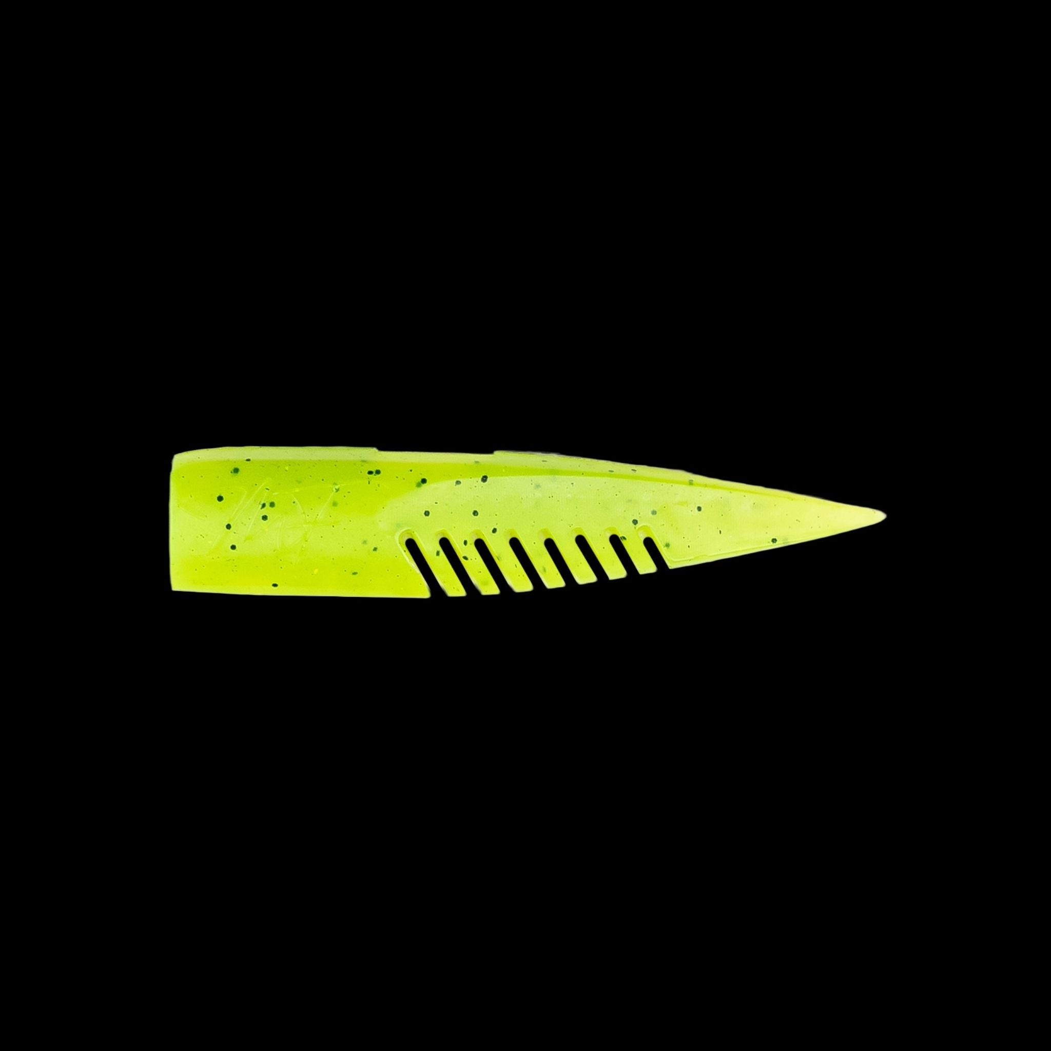 yellow comb-like texture fishing lure on a black background
