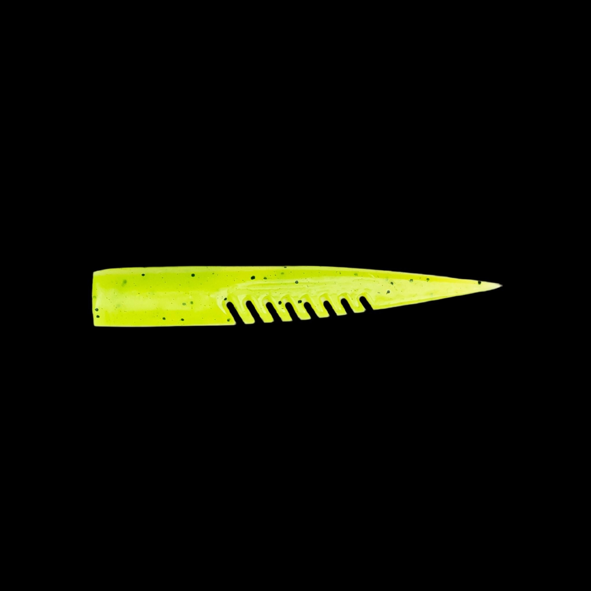 yellow comb-like texture fishing lure on a black background