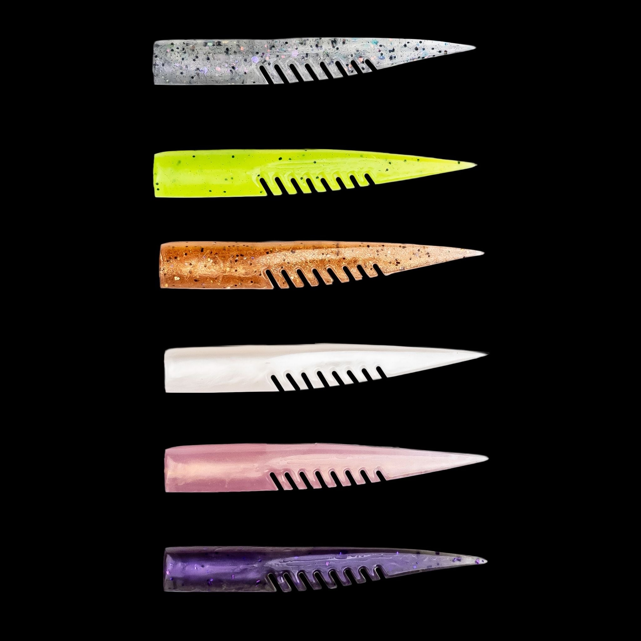 Set of colorful plastic fishing lures with a comb-like texture on a black background