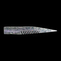 silver comb-like texture fishing lure on a black background