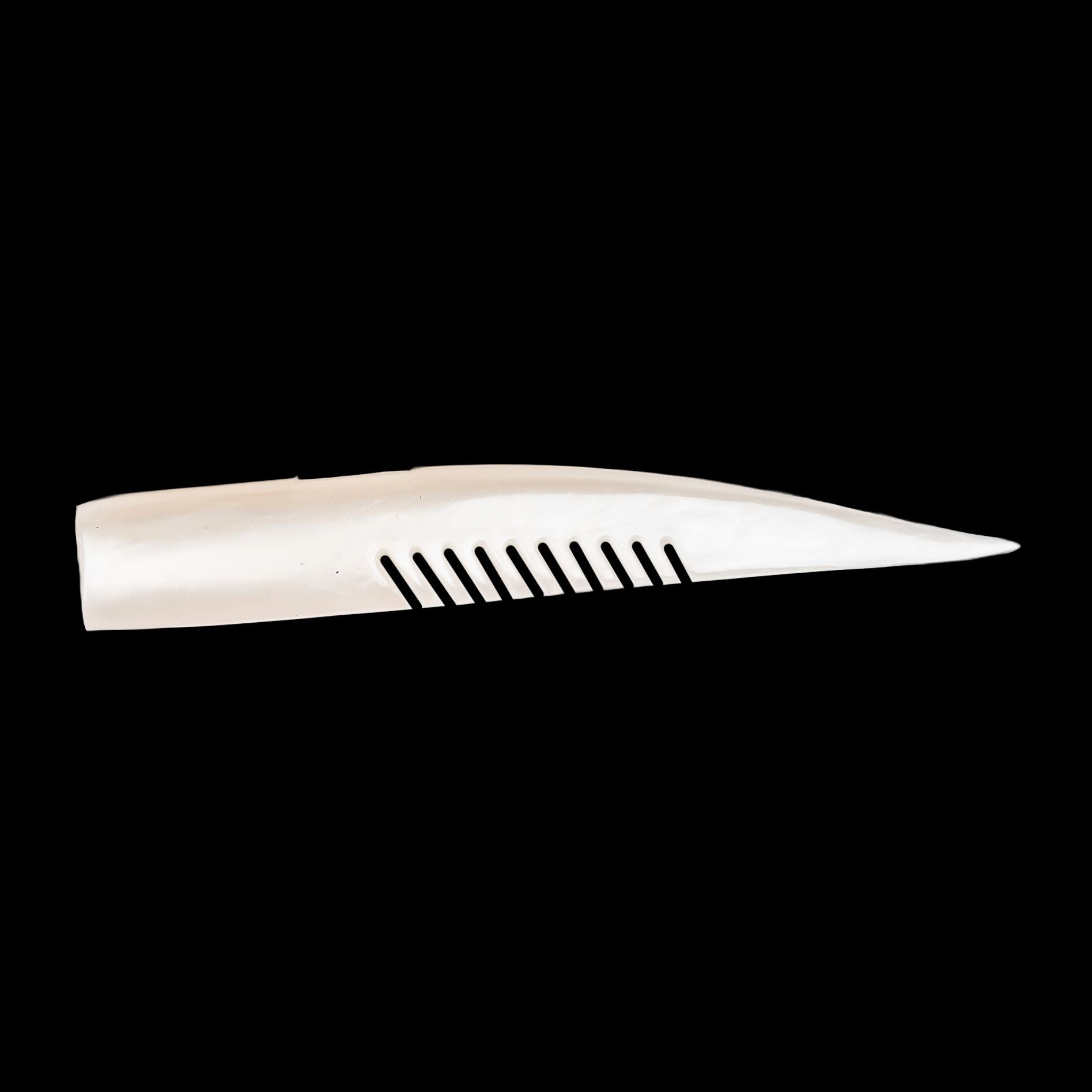 white comb-like texture fishing lure on a black background