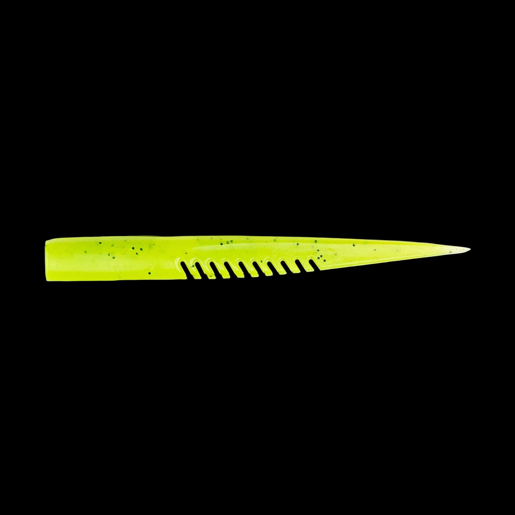 yellow comb-like texture fishing lure on a black background