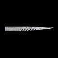 silver fishing lure with a comb-like texture on a black background