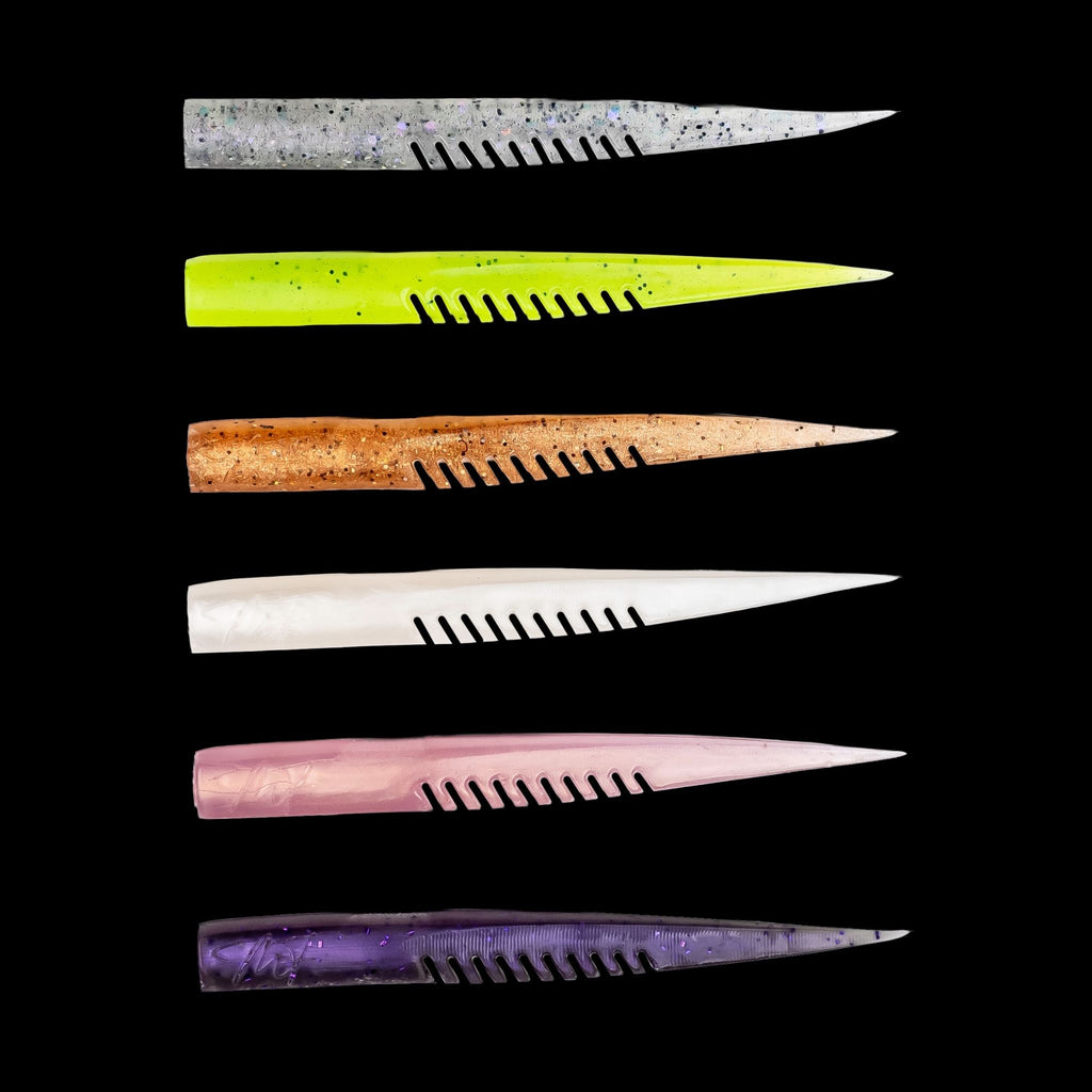Set of colorful plastic fishing lures with a comb-like texture on a black background