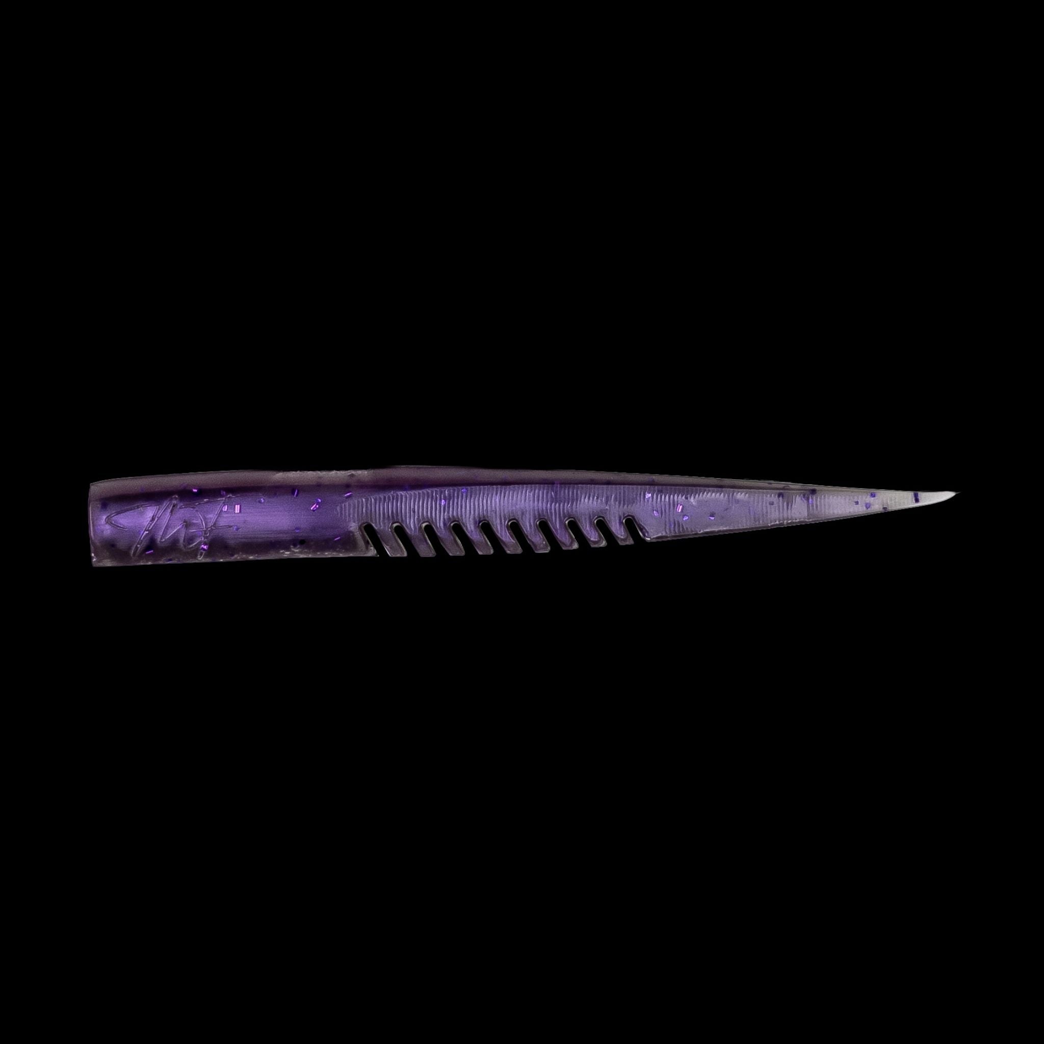 purple fishing lure with a comb-like texture on a black background