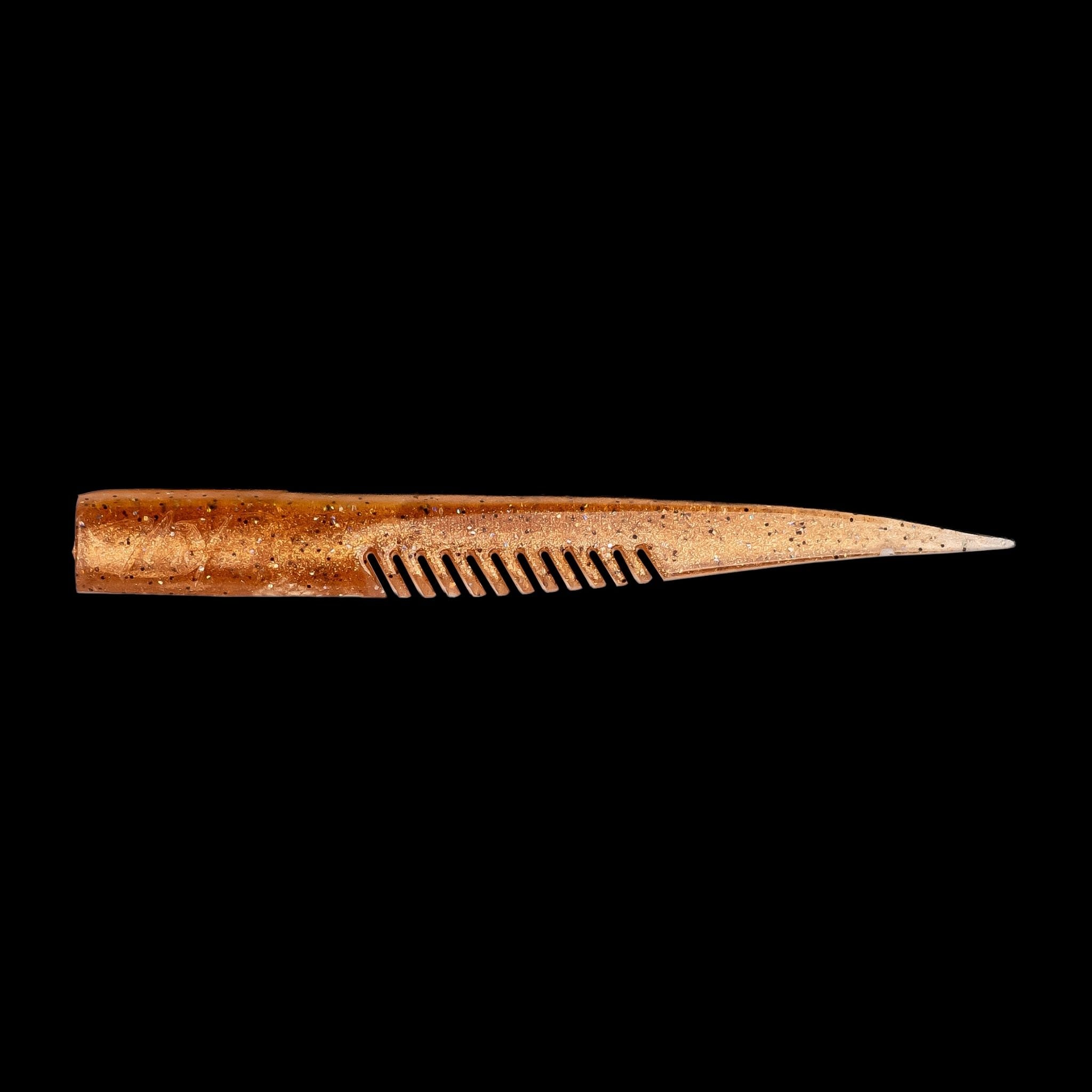 brown comb-like texture fishing lure on a black background