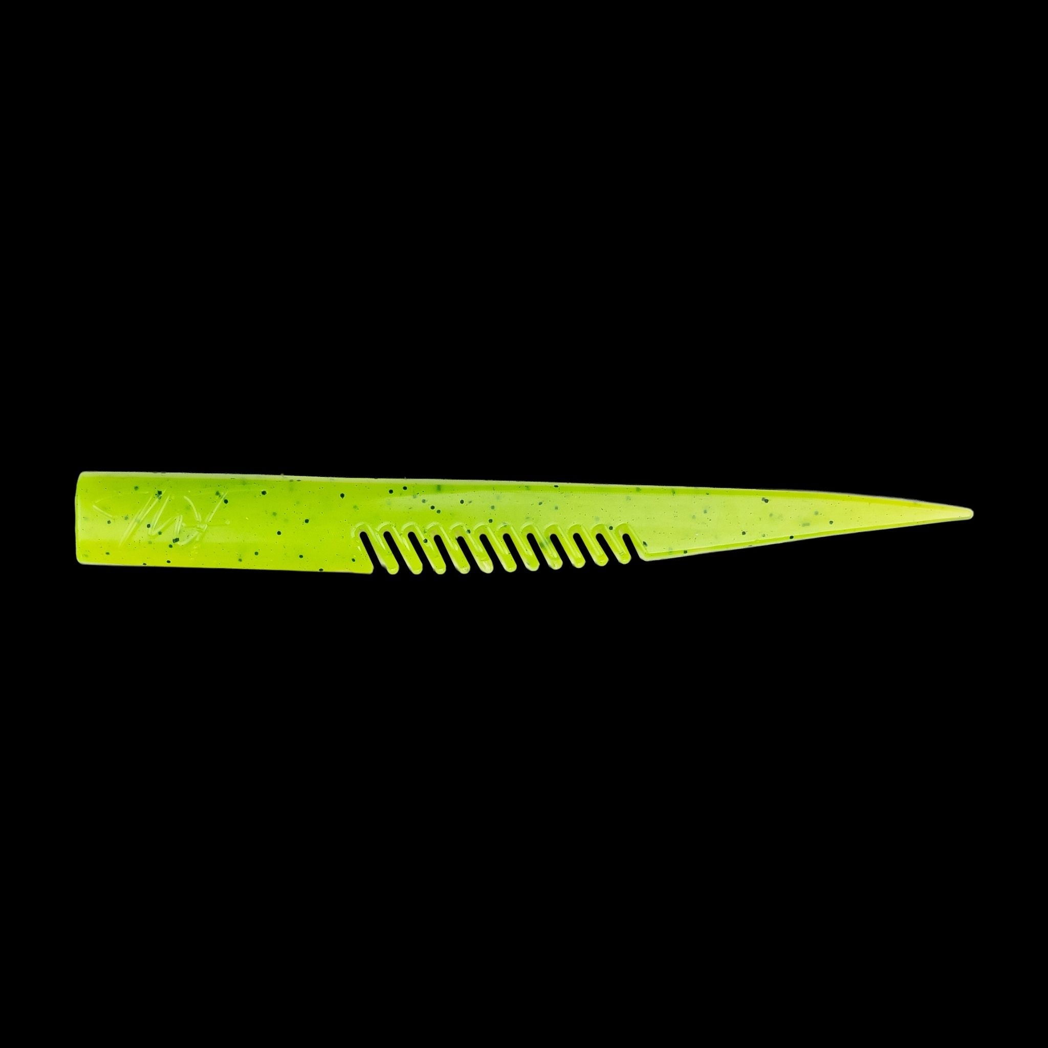 yellow comb-like texture fishing lure on a black background