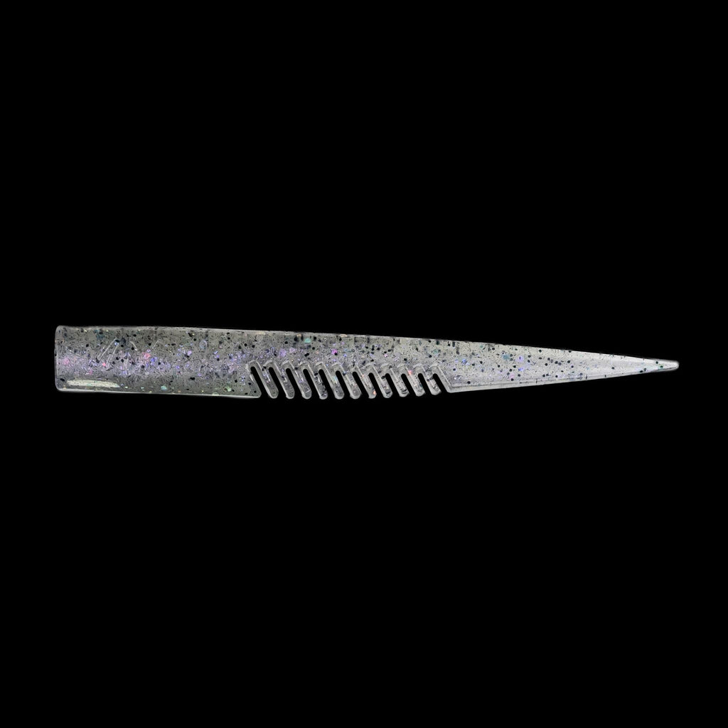 silver comb-like texture fishing lure on a black background