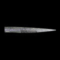 silver comb-like texture fishing lure on a black background