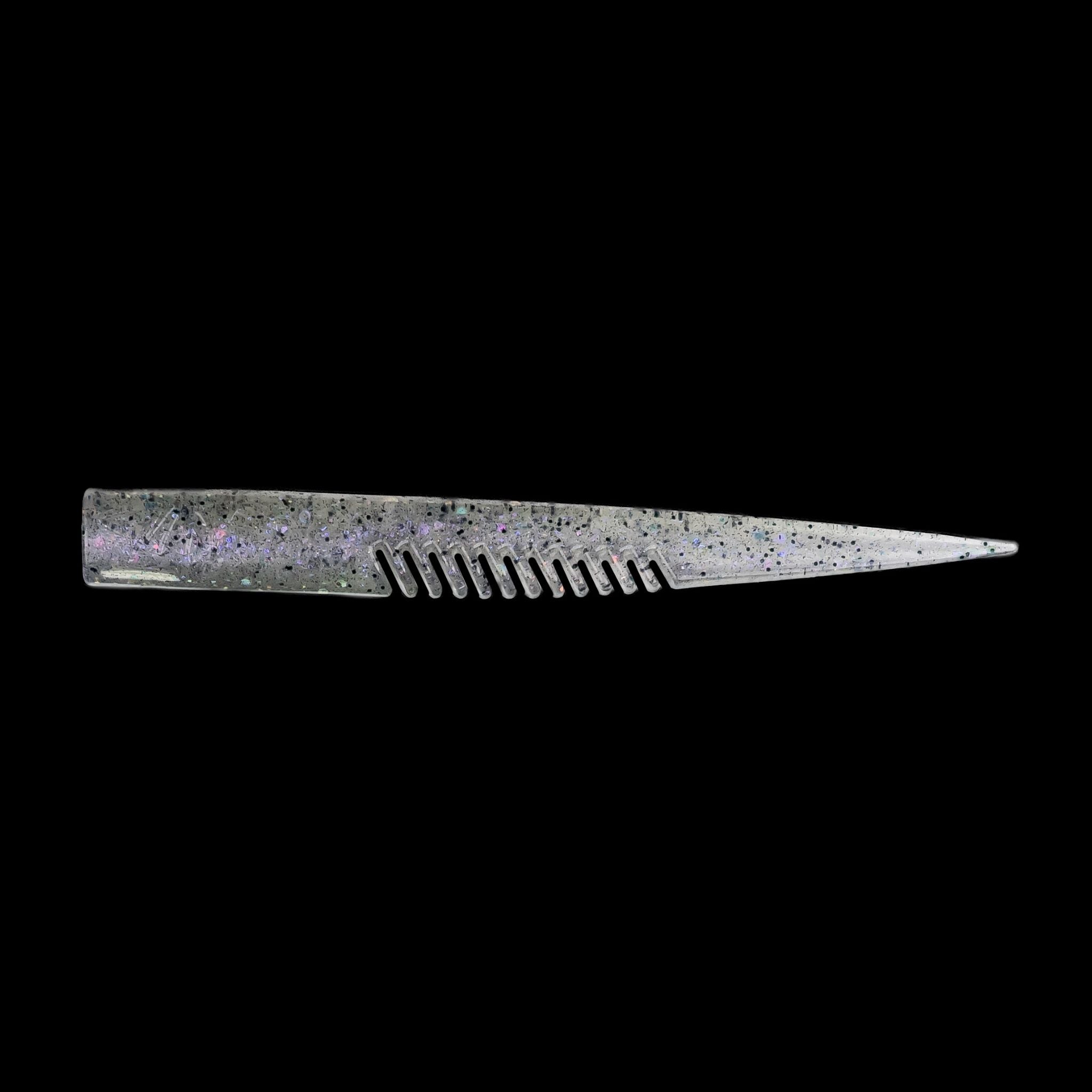 silver comb-like texture fishing lure on a black background