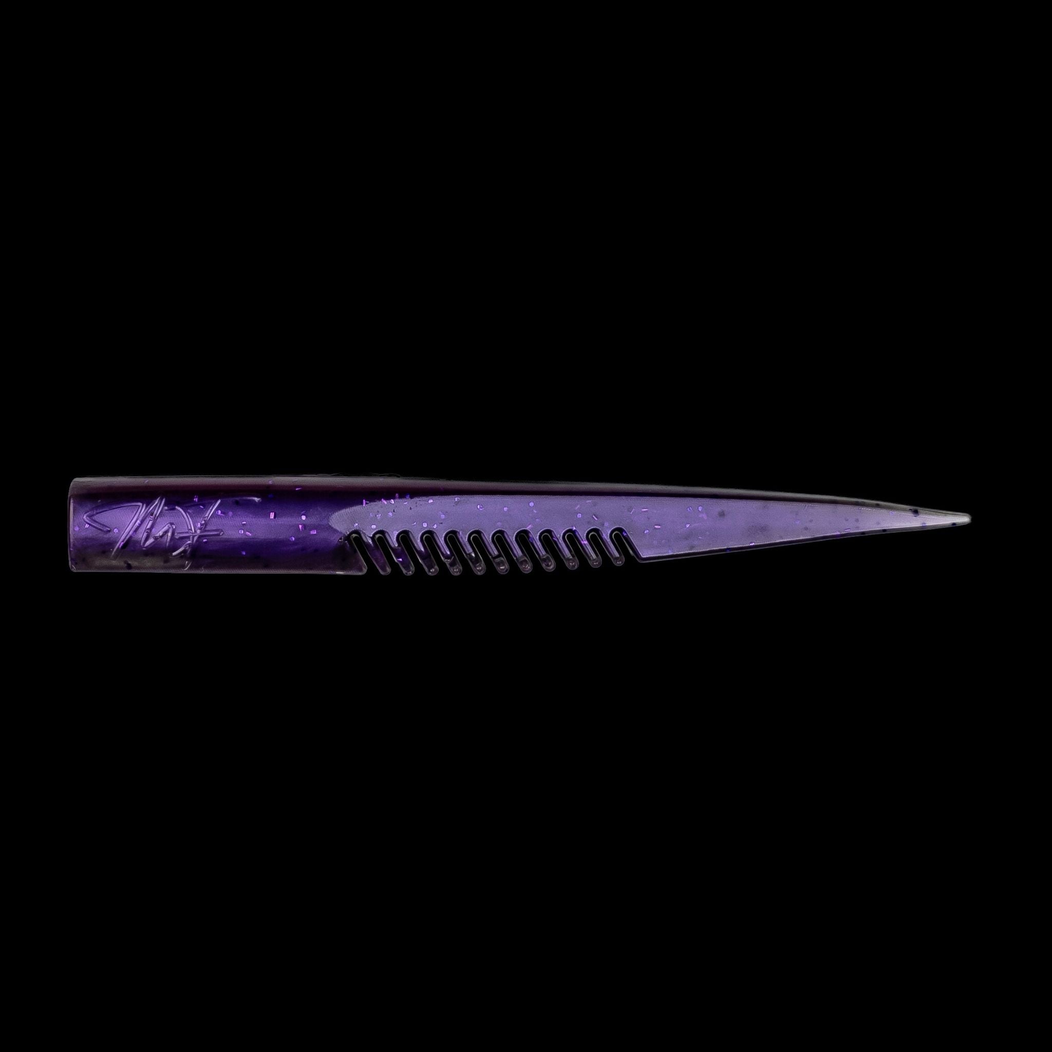 Purple comb-like texture fishing lure on a black background
