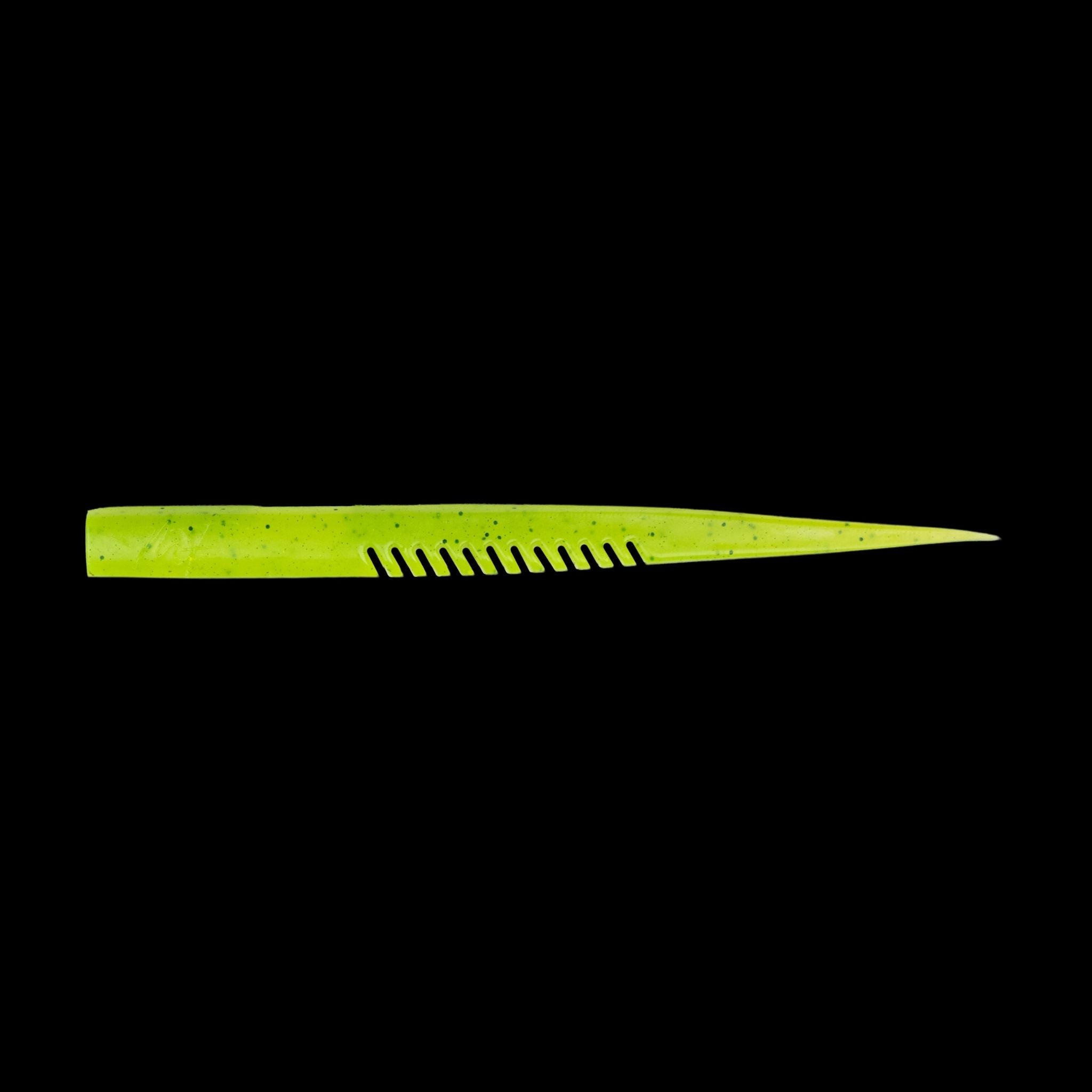 yellow comb-like texture fishing lure on a black background