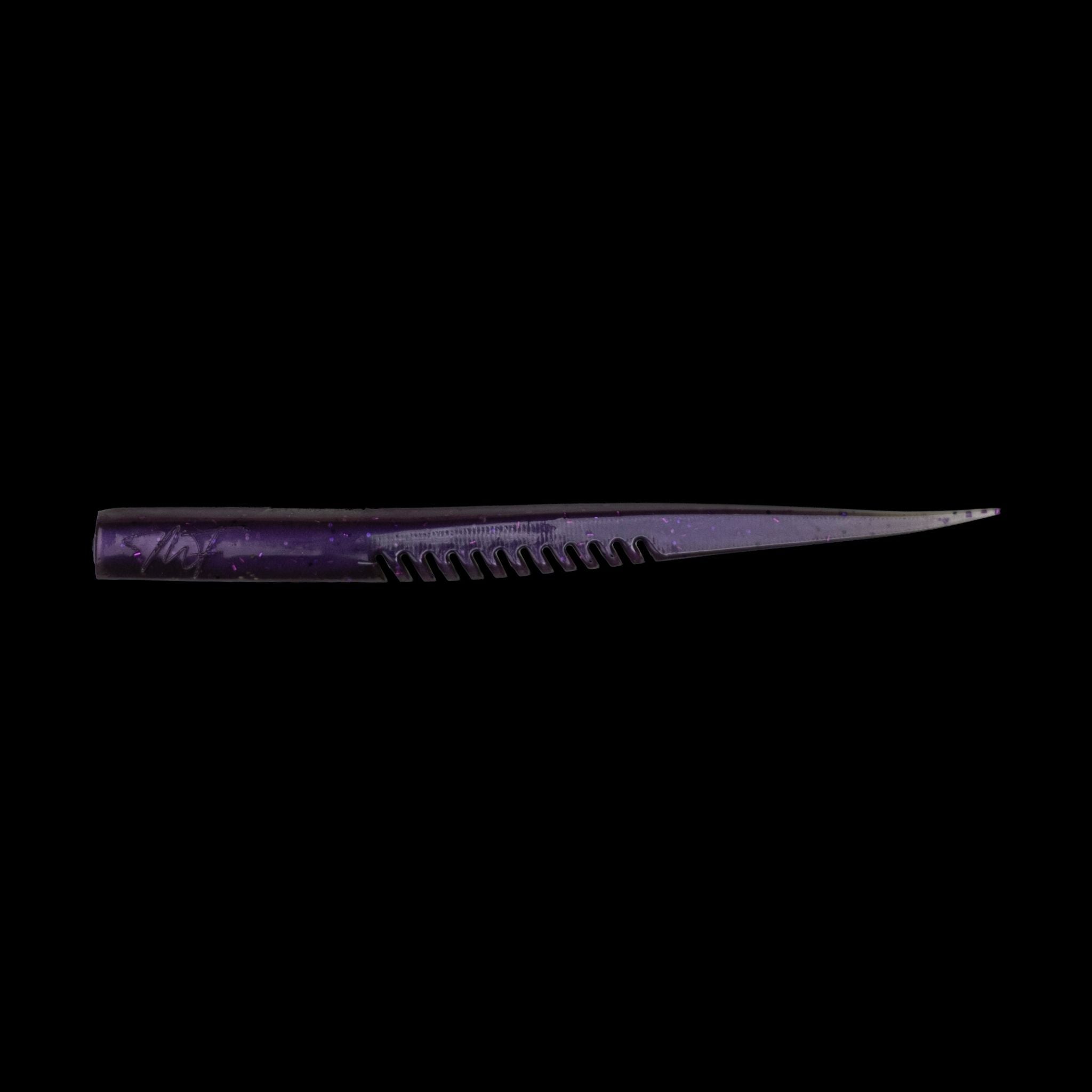 purple fishing lure on black background